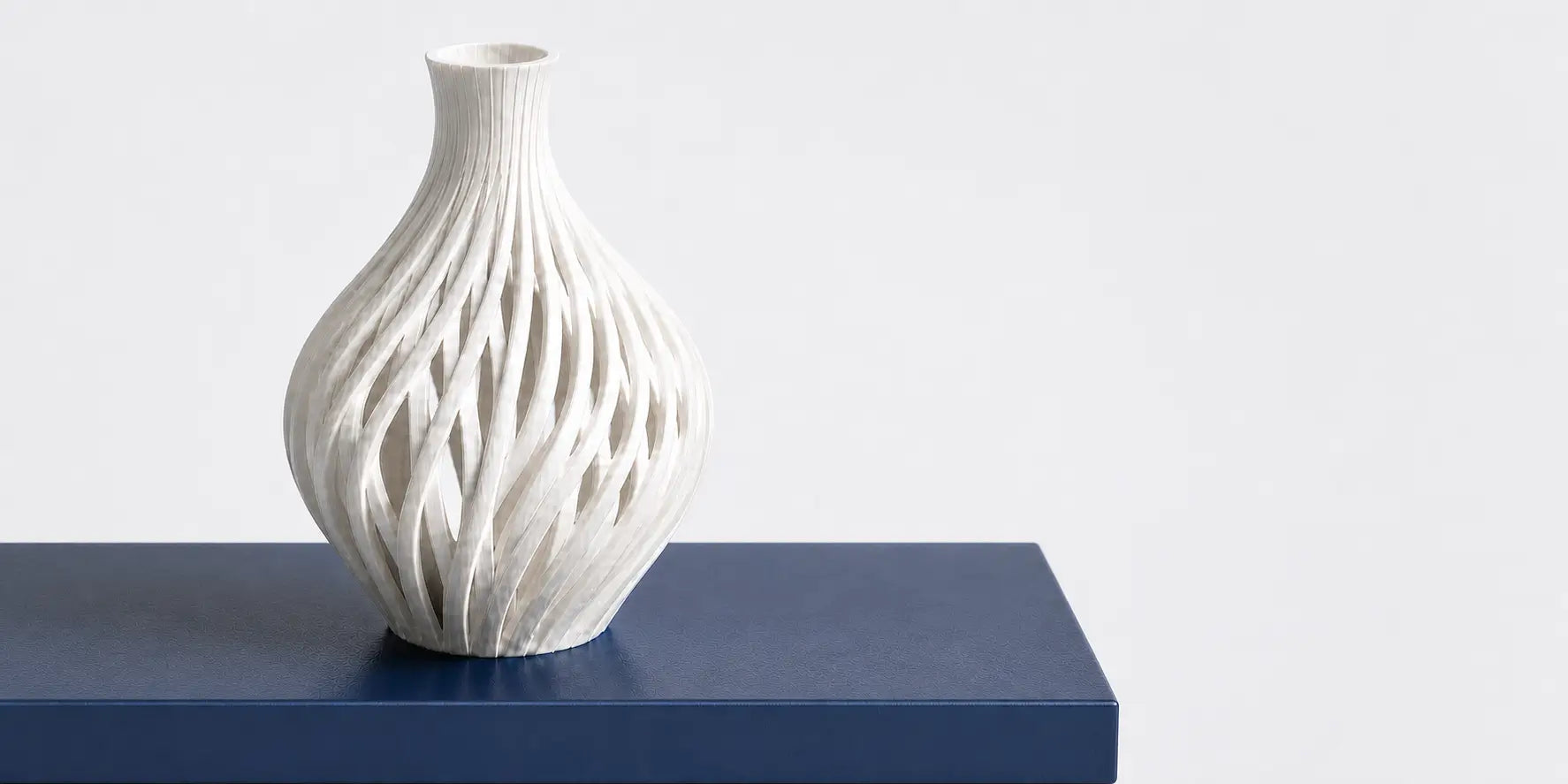 Intricate 3D printed white parametric vase sculpture with twisting lattice designs, displaying the flawless surface finish of LANDU aesthetic filaments.