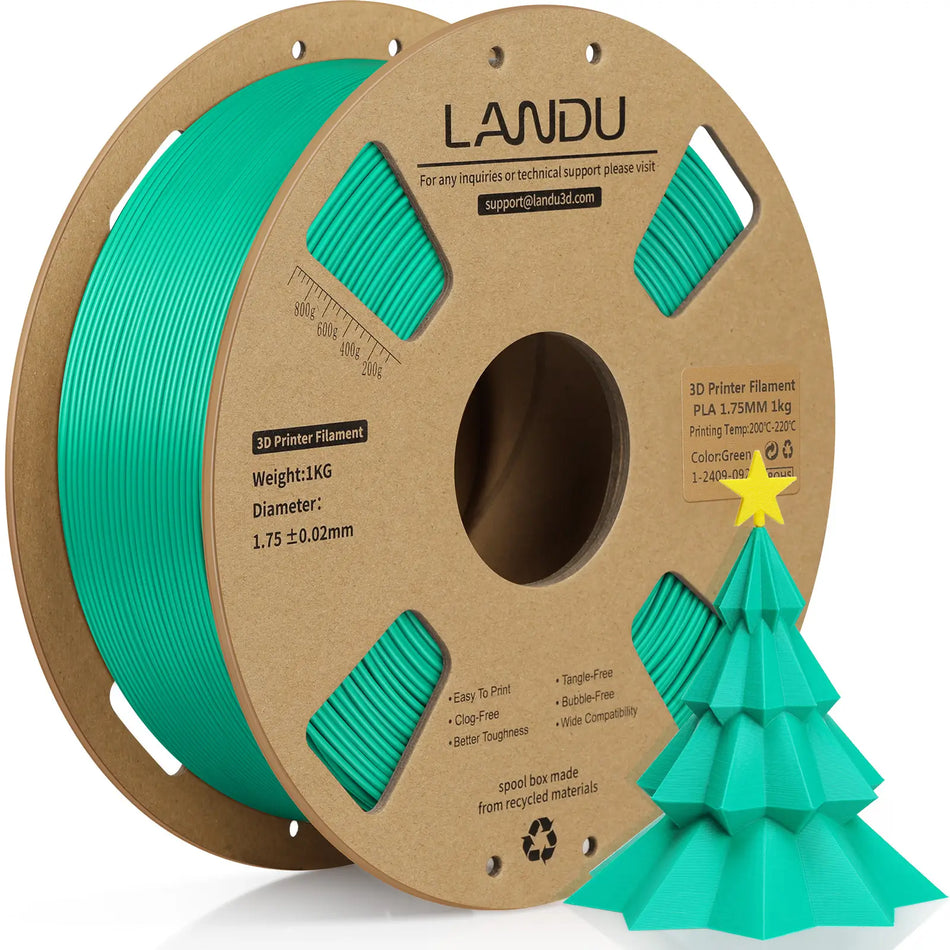 LANDU Green PLA 3D printer filament 1kg spool next to a vibrant 3D printed green Christmas tree.