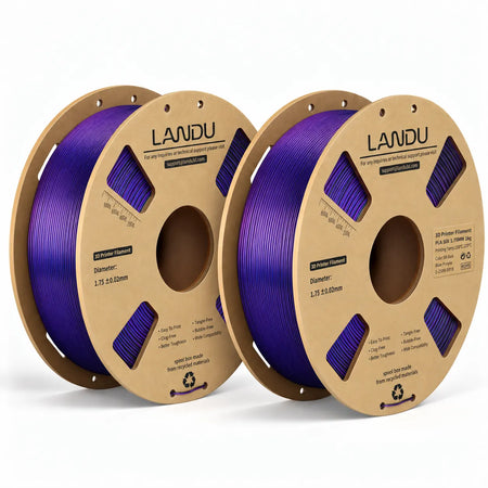 LANDU Tri-Color Black Blue Purple Silk PLA 3D printer filament 2kg spool alongside a glossy, color-shifting 3D printed dragon and egg.
