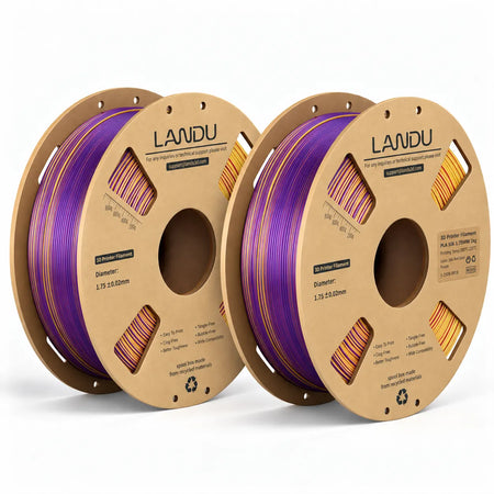 LANDU Red Gold Purple Tri-Color Silk PLA 3D printer filament 2kg spool next to a regal sunset-hued color-shifting 3D printed dragon.