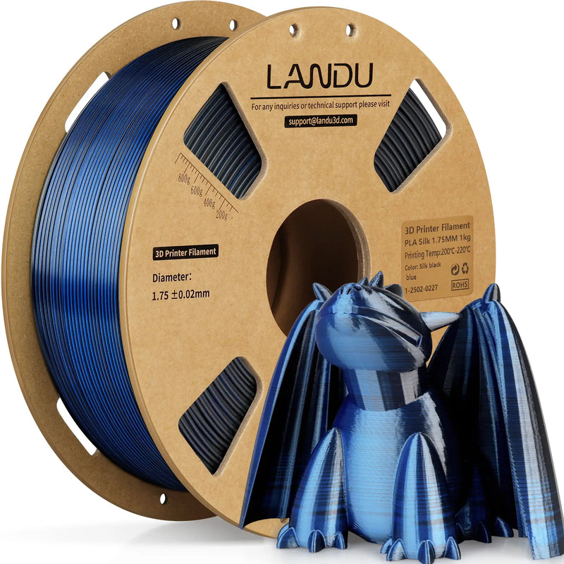 LANDU Blue and Black Dual Color Silk PLA 3D printer filament 1kg spool displayed with a glossy 3D printed color shifting dragon.