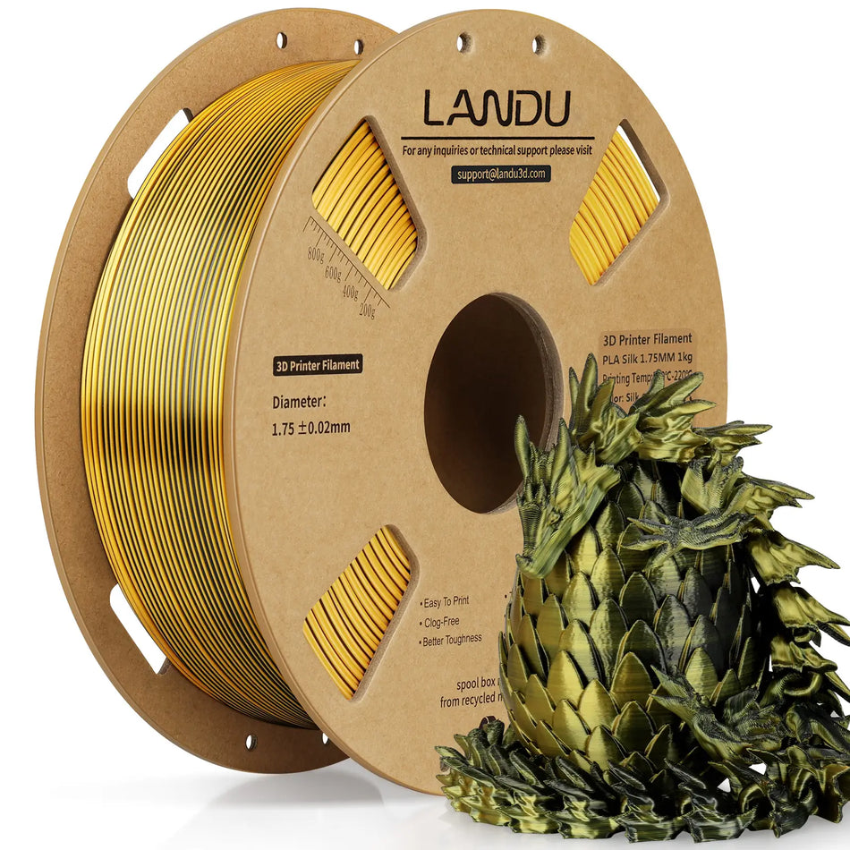 LANDU Gold and Black Dual Color Silk PLA 3D printer filament 1kg spool next to a premium 3D printed color shifting dragon and egg.
