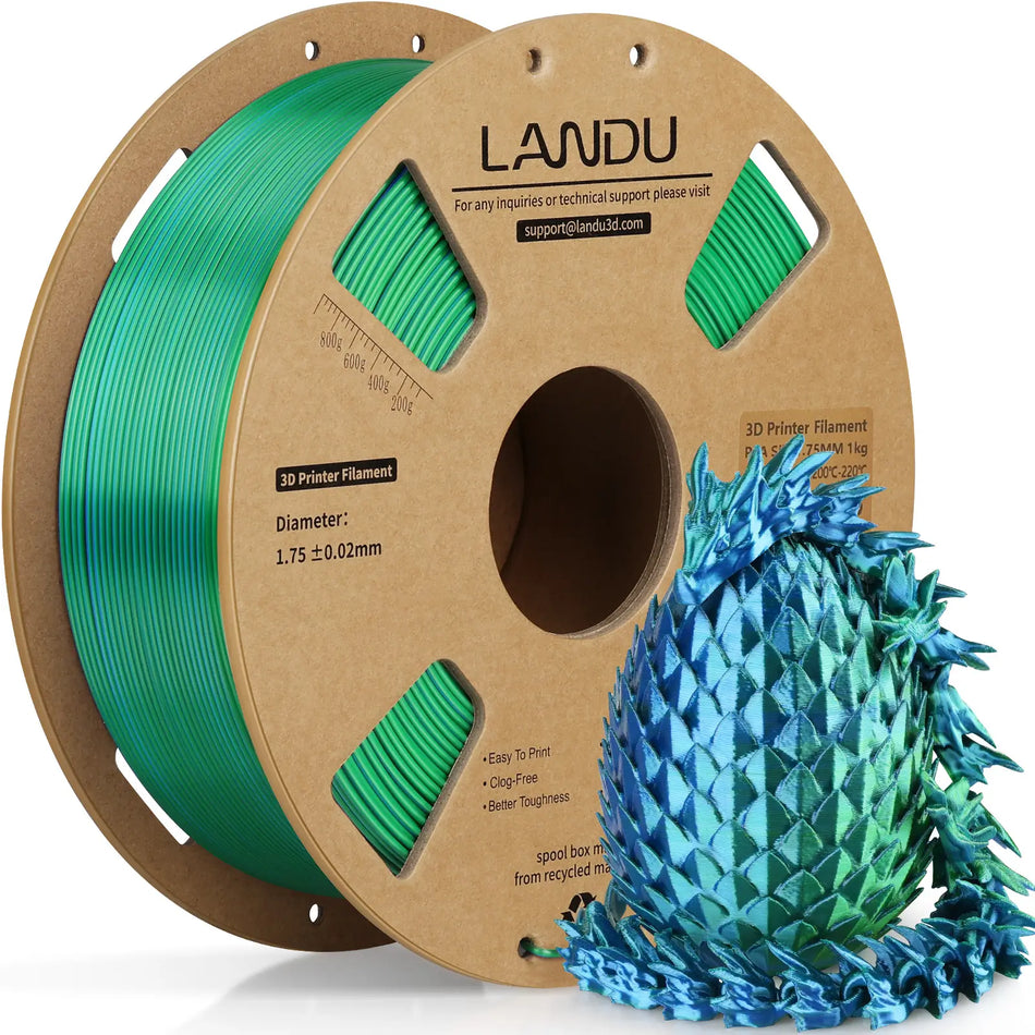 LANDU Green and Blue Dual Color Silk PLA 3D printer filament 1kg spool displayed with a vibrant 3D printed color shifting dragon and egg.