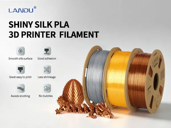 LANDU Shiny Silk PLA 3D printer filament spools in silver, gold, and copper alongside a 3D printed articulated dragon.
