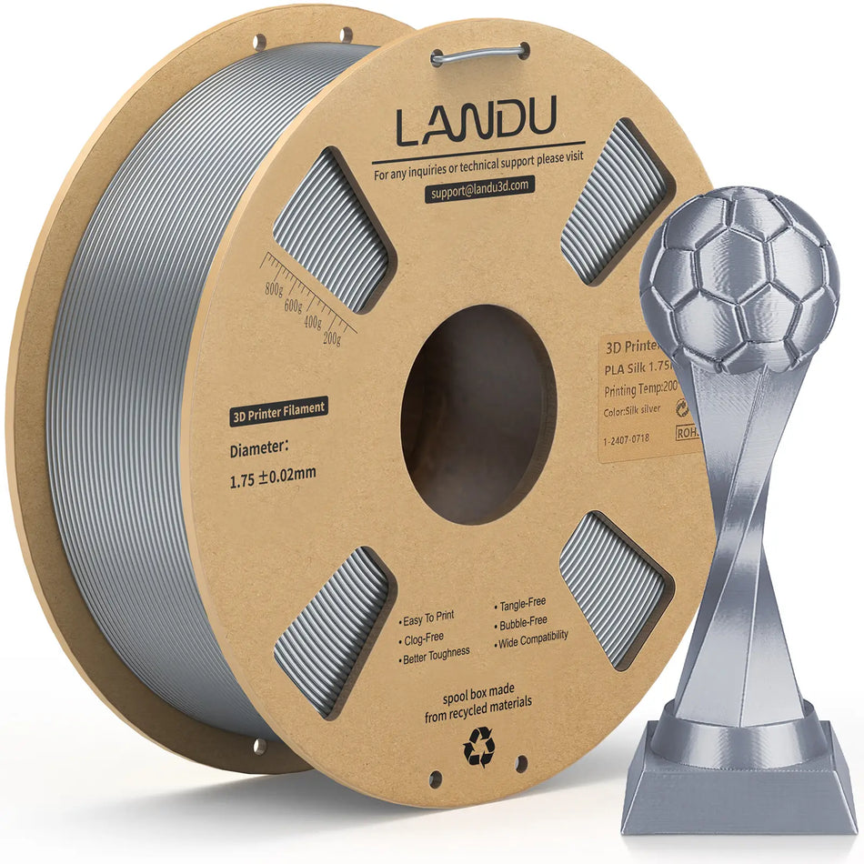 LANDU Silver Silk PLA 3D printer filament 1kg spool alongside a shiny and realistic 3D printed silver soccer trophy.