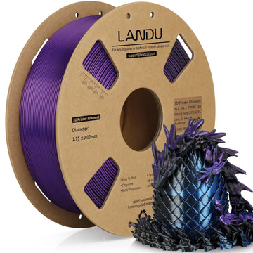 LANDU Tri-Color Black Blue Purple Silk PLA 3D printer filament 1kg spool alongside a glossy, color-shifting 3D printed dragon and egg.