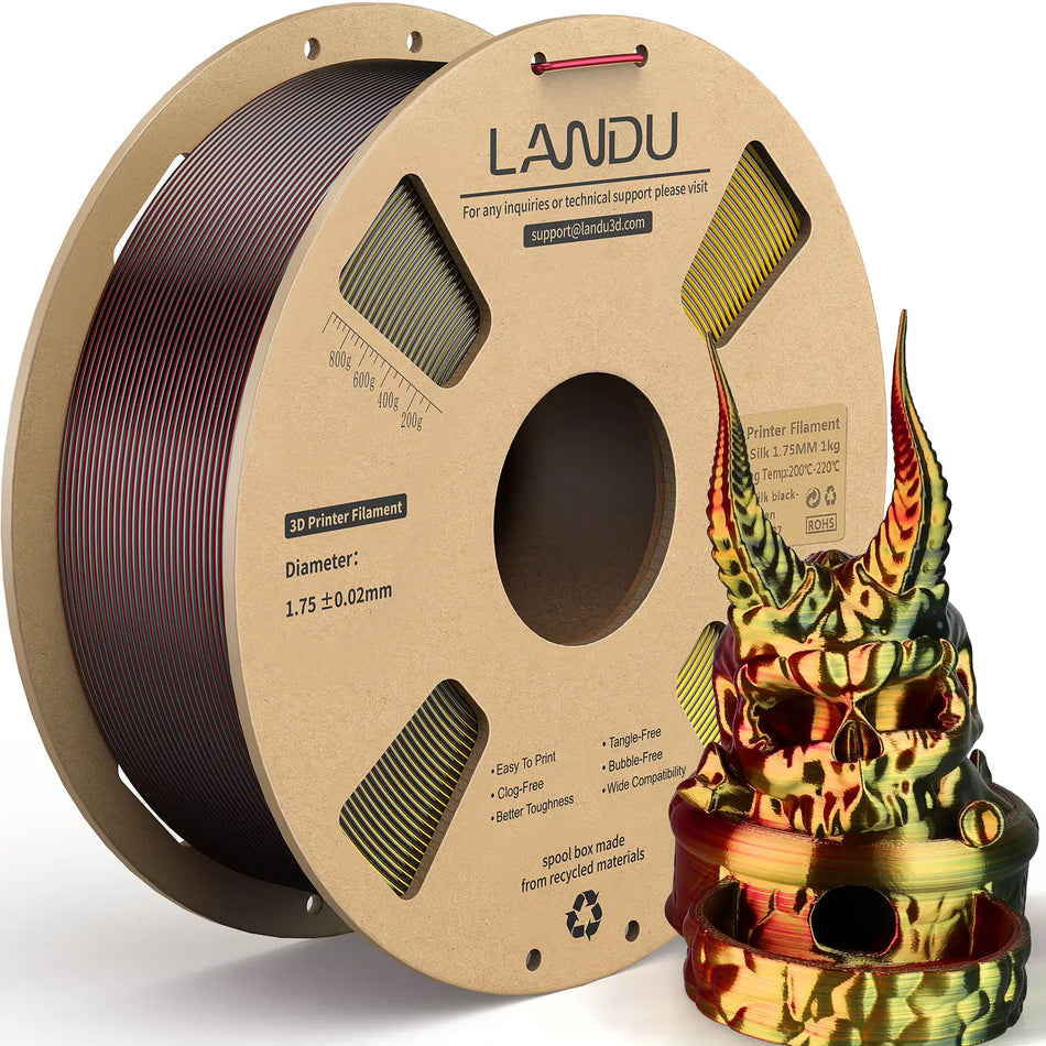 LANDU Tri-Color Black Red Golden Silk PLA 3D printer filament 1kg spool displayed with an intimidating color-shifting 3D printed horned skull.
